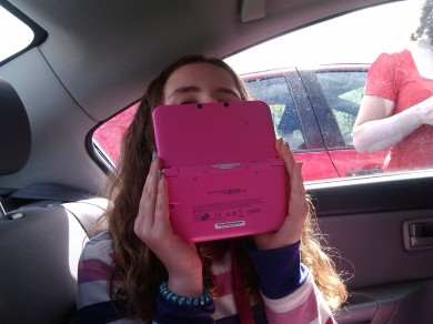 meabh, hiding from the camera with my ds